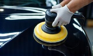 Detailed view of car being polished professionally