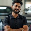 Manoj Singh posing with his car after detailing
